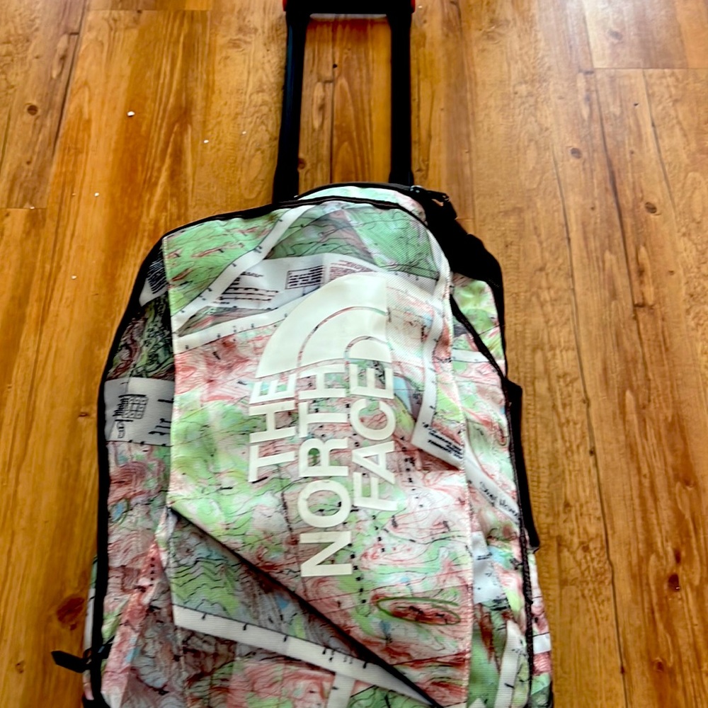 The North Face - rolling duffel bag